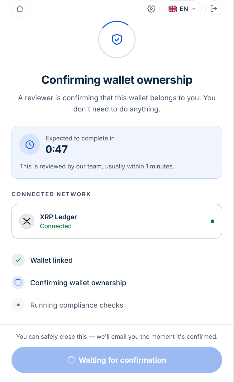 The Confirming wallet ownership screen, showing the connected network and a progress list with wallet linked already ticked.